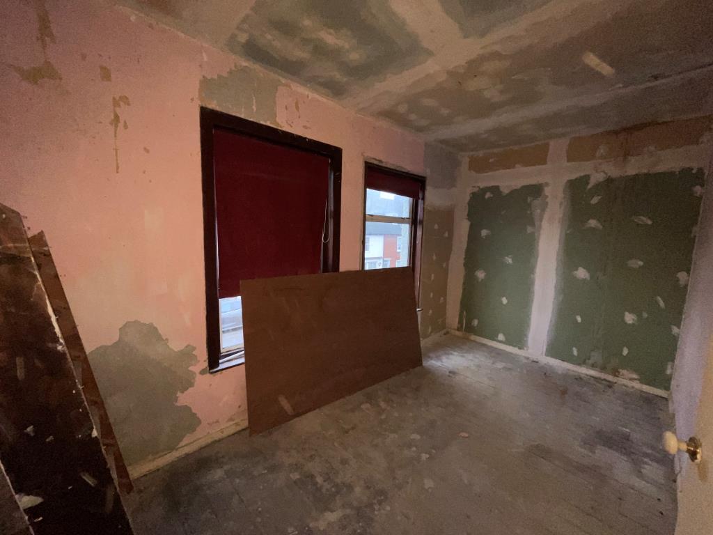 Lot: 57 - FLAT FOR REFURBISHMENT/COMPLETION - Bedroom stripped back with window
